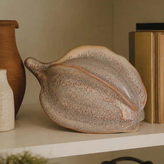 Close-up of smooth glazed finish on ceramic coco pod