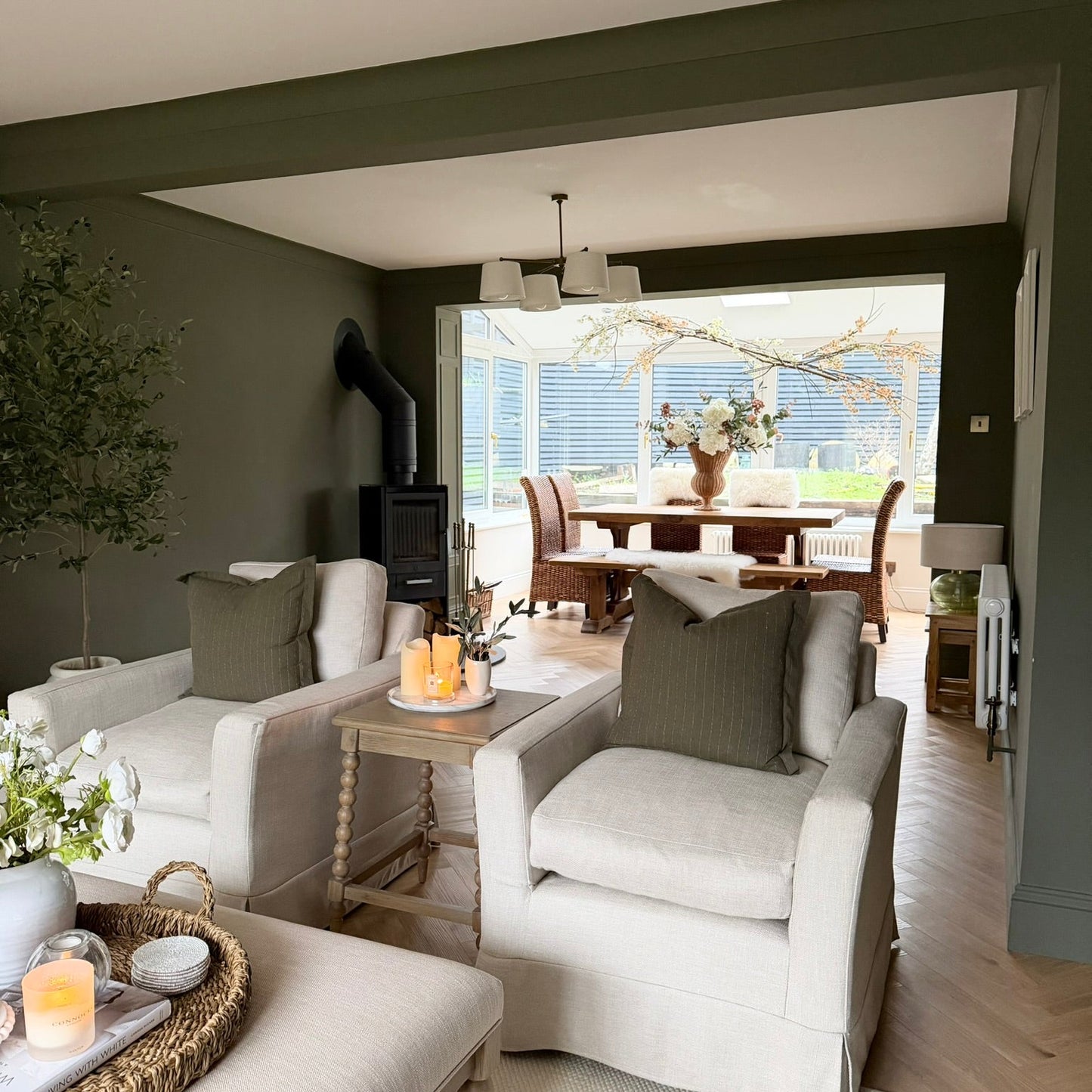 Living room with gray sofa, coffee table, and decorative items.