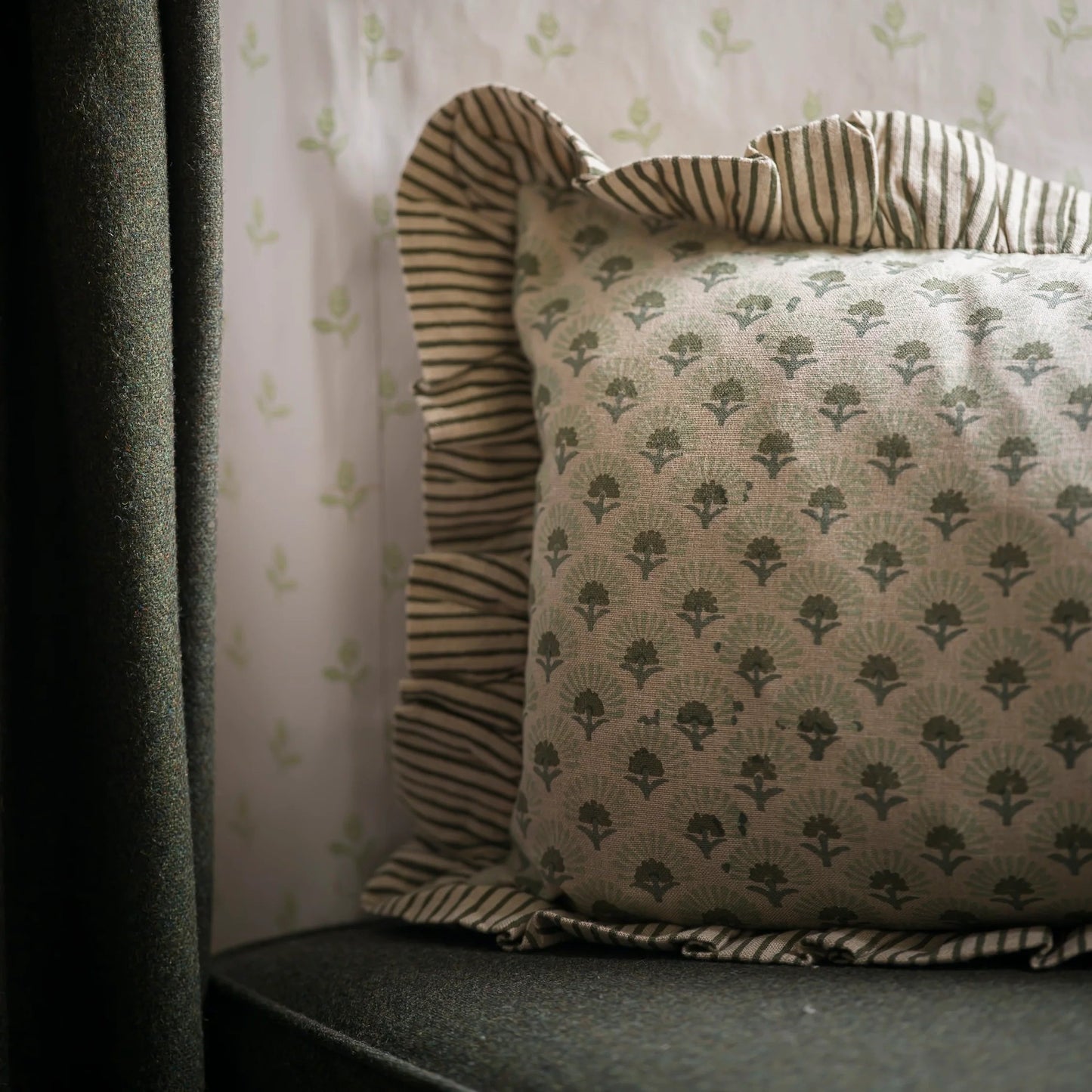 floral cushion, block print cushion, hand block printed cushion, floral block print cushion, artisan cushion, decorative cushion, patterned cushion, striped trim cushion, floral patterned cushion, luxury feather cushion, feather filled cushion, sofa cushion, armchair cushion, bed cushion, cushion for sofa styling, layered cushions, traditional textile cushion, artisan home decor, printed cushion, classic floral cushion, country home decor, cottage style cushion, timeless home accessories, soft furnishings, 