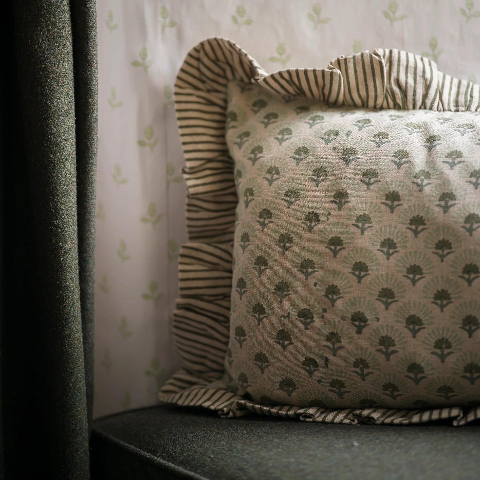 floral cushion, block print cushion, hand block printed cushion, floral block print cushion, artisan cushion, decorative cushion, patterned cushion, striped trim cushion, floral patterned cushion, luxury feather cushion, feather filled cushion, sofa cushion, armchair cushion, bed cushion, cushion for sofa styling, layered cushions, traditional textile cushion, artisan home decor, printed cushion, classic floral cushion, country home decor, cottage style cushion, timeless home accessories, soft furnishings, 