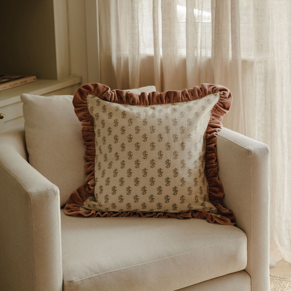 Floral block print cushion with striped trim
Hand block printed floral cushion with feather pad
Artisan floral cushion for sofa styling
Decorative floral cushion with striped border
Traditional block print cushion for layered interiors
Floral patterned cushion styled on an armchair
Luxury feather filled floral cushion
Classic floral cushion with complementary stripe trim