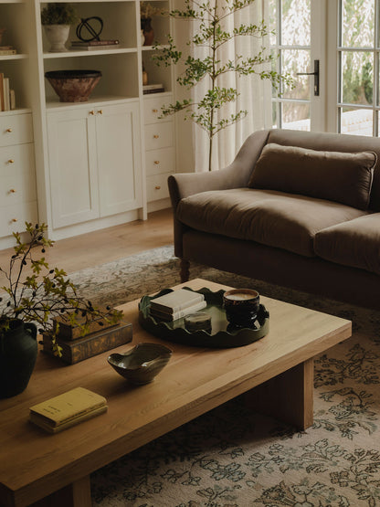 Ceramic melted effect bowl styled on coffee table with home decor