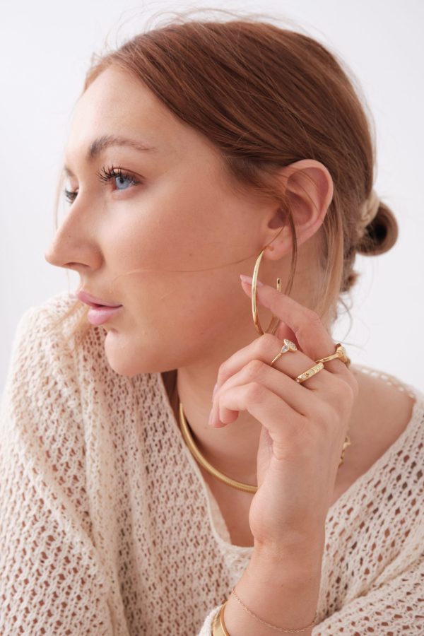 model wearing pearl & chain jewellery