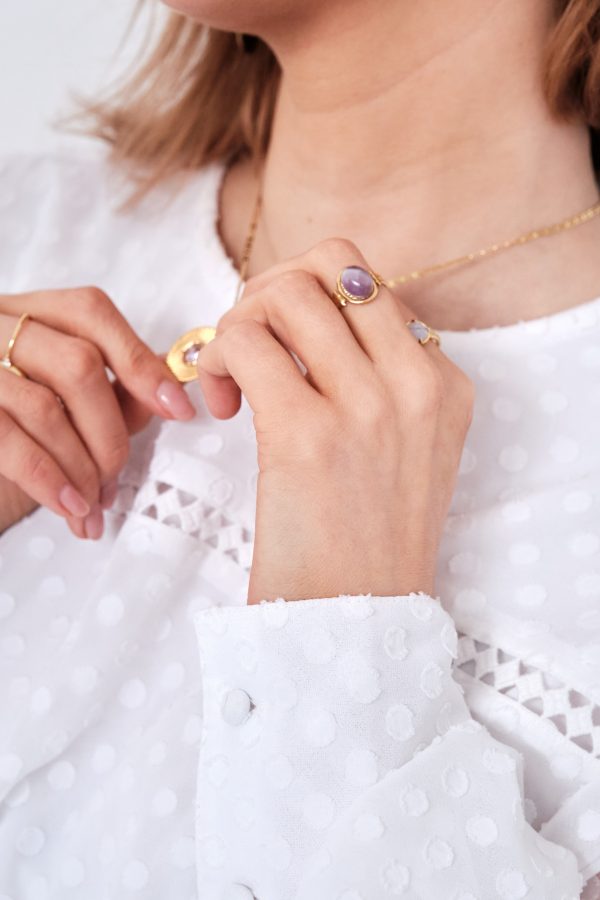 model wearing purple stone open ring