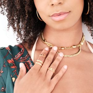 model wearing gold beaded choker necklace