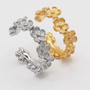 silver and gold flower rings