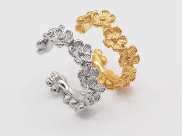 silver and gold flower rings