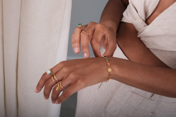 model wearing pearl & chain jewellery